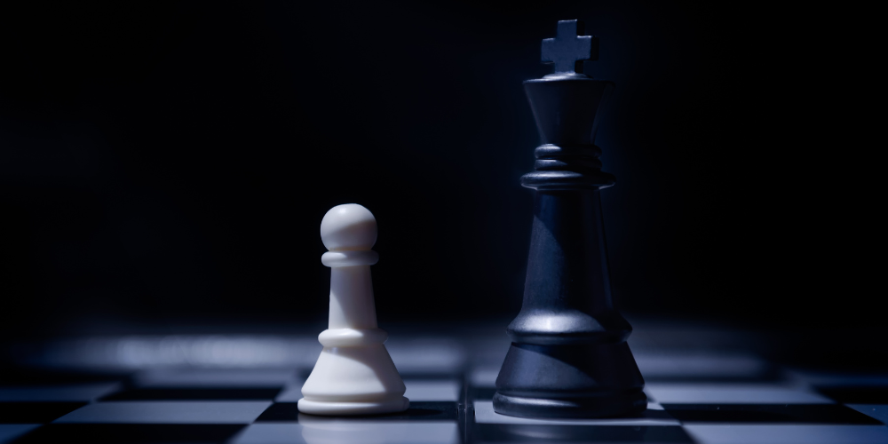 Chess pawn and king close-up, representing small business advantages over big corporate competitors